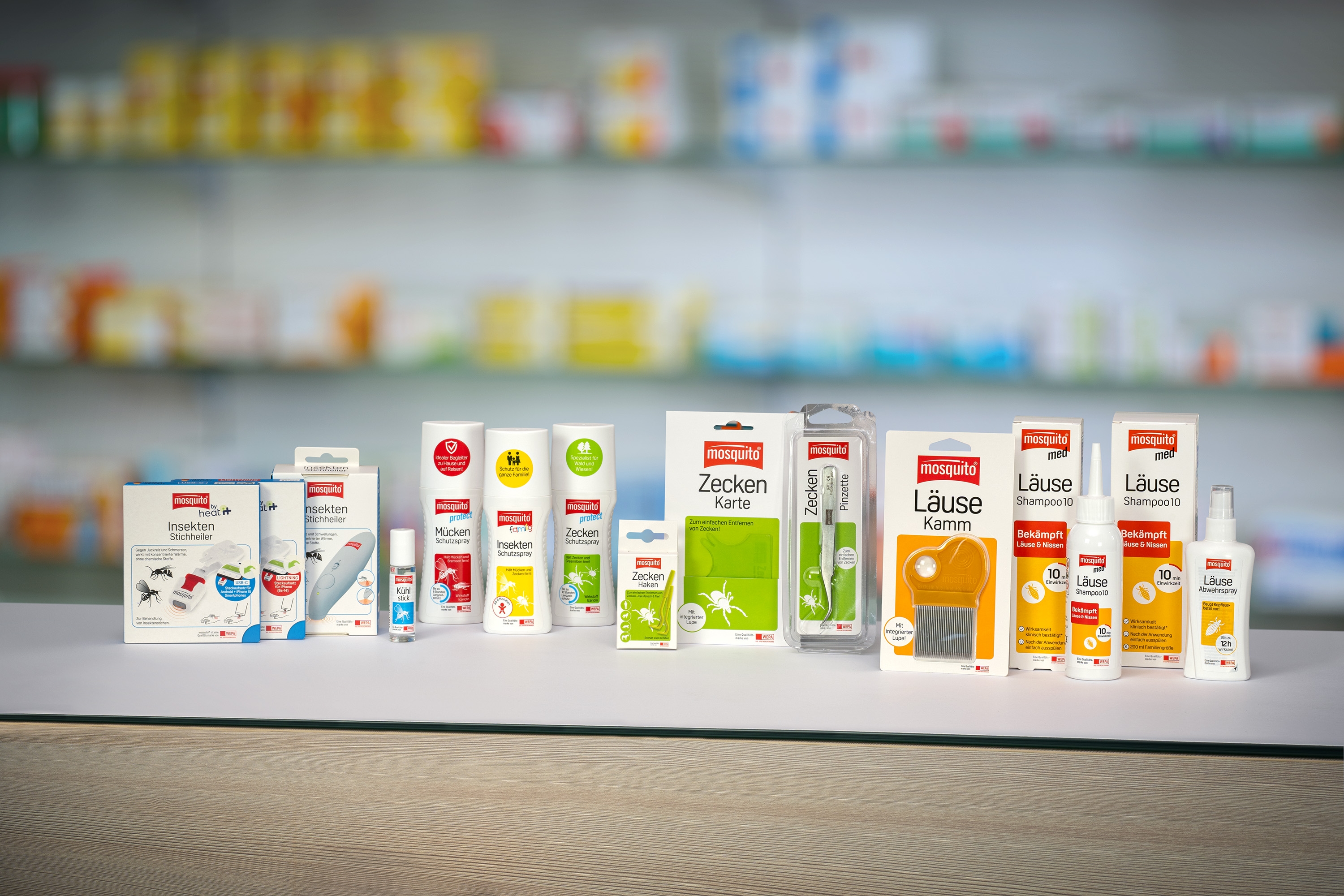 Produktwelt Alle mosquito Produkte stehen nebeneinander auf einem HV Tisch