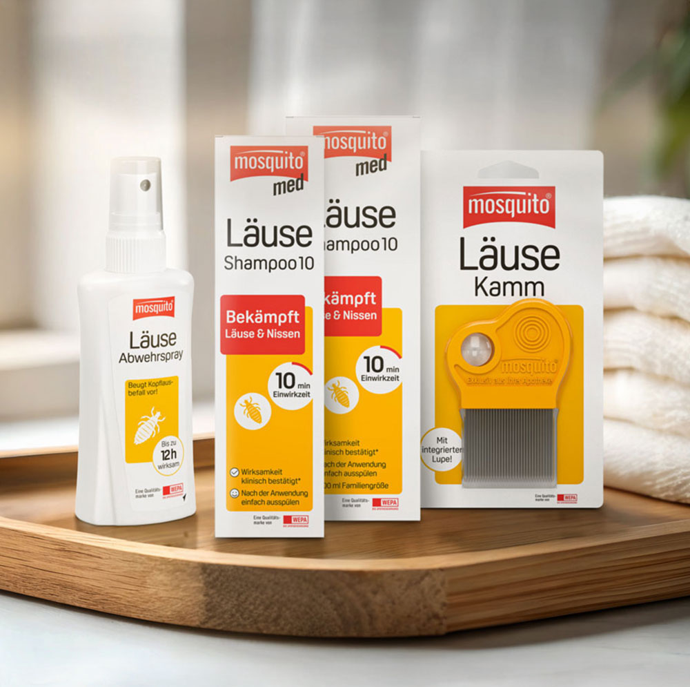 A sandwich on a wooden table in a sunny meadow